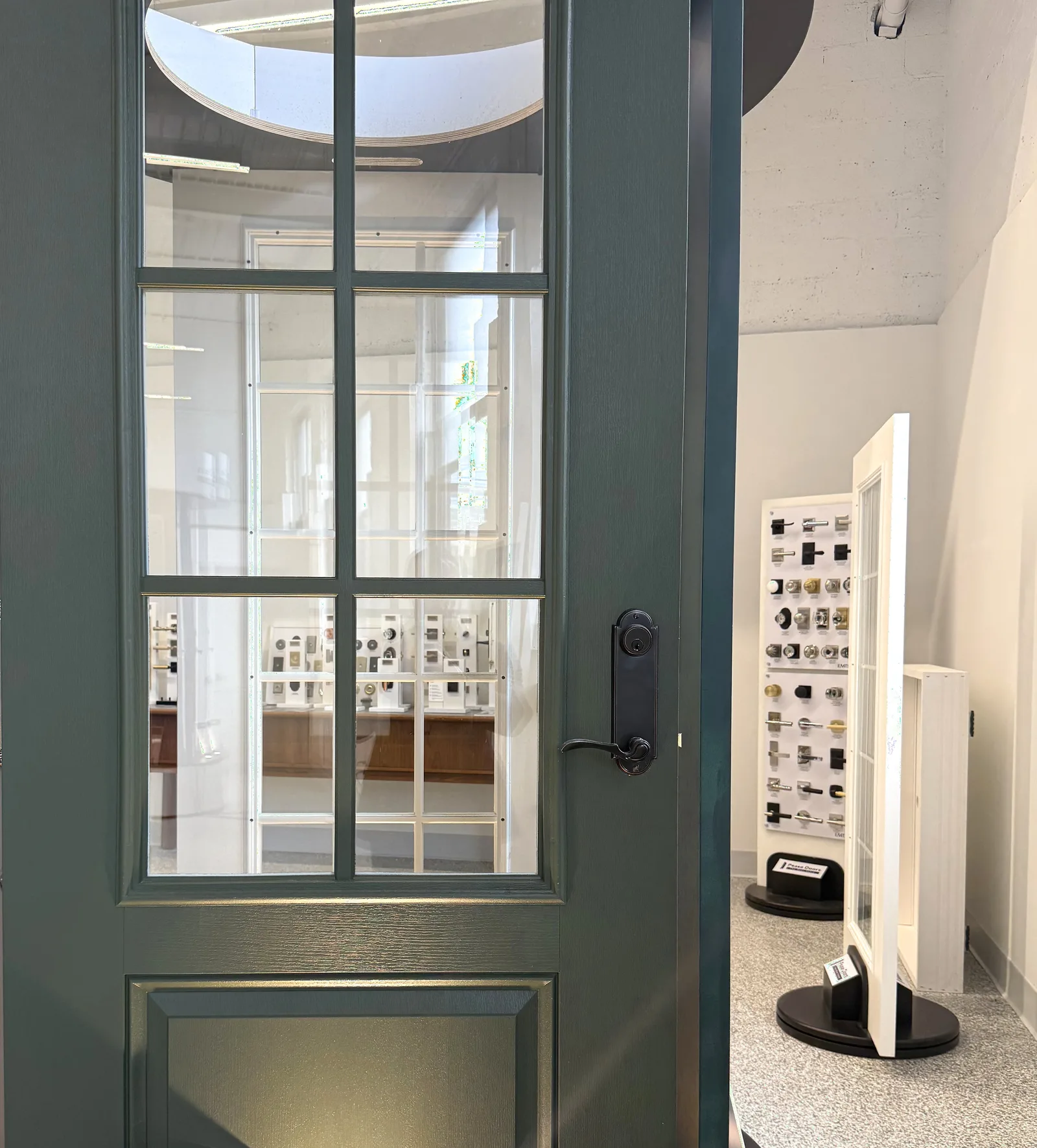 Decorative door hardware installed on display doors in a dealer showroom
